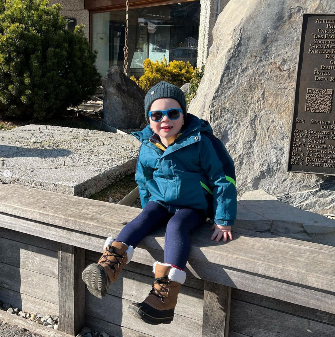 Boy at ski lodge wearing sunnies sunglasses