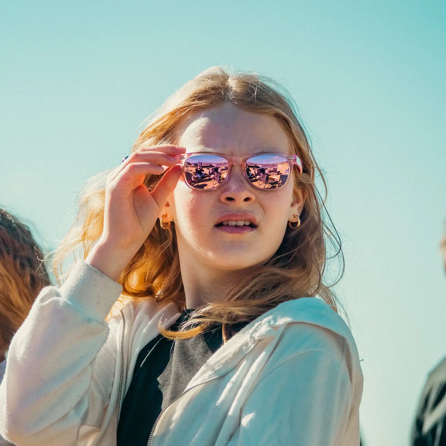 Girl wearing pink crystal wayfarers