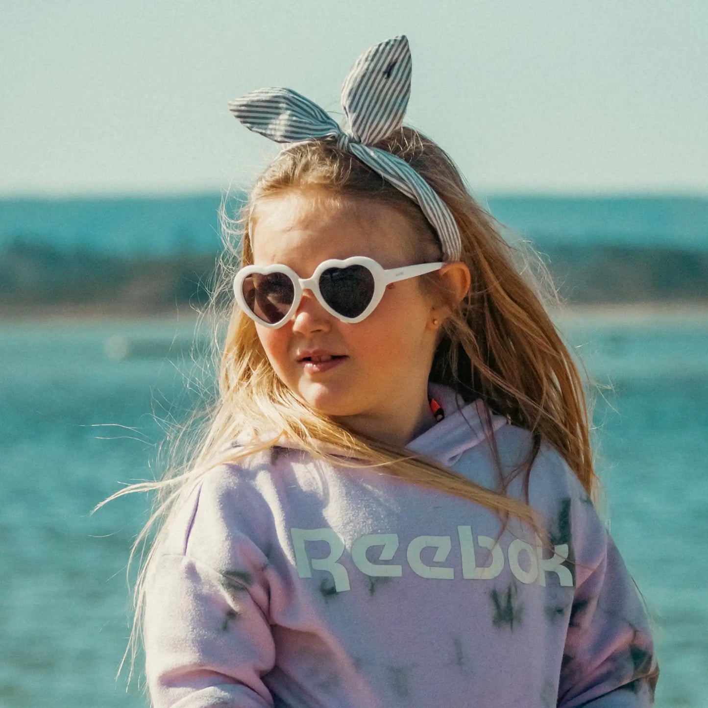 Girl wearing white amour sunglasses
